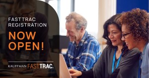 Two people sit in front of a shared computer, collaborating. The text overlay reads: "FastTrac Registration Now Open!"